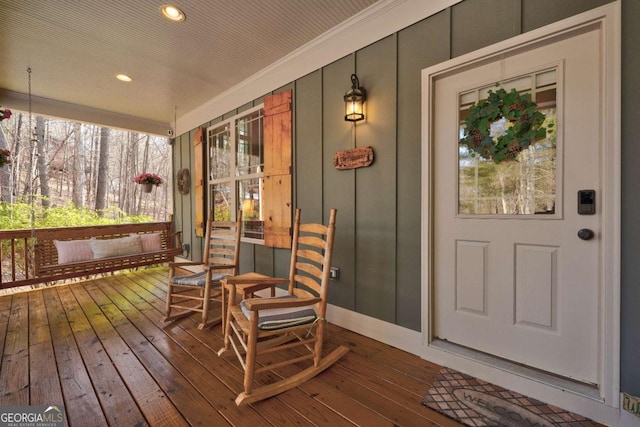 wooden terrace with a porch