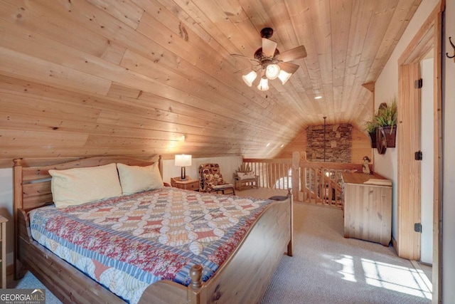 bedroom featuring ceiling fan, carpet, vaulted ceiling, wooden walls, and wooden ceiling