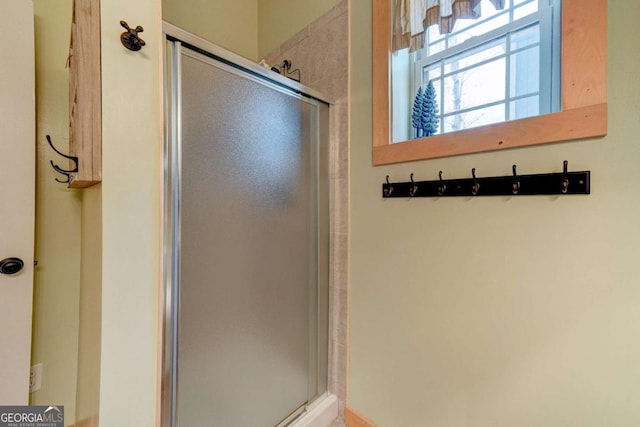 bathroom featuring an enclosed shower