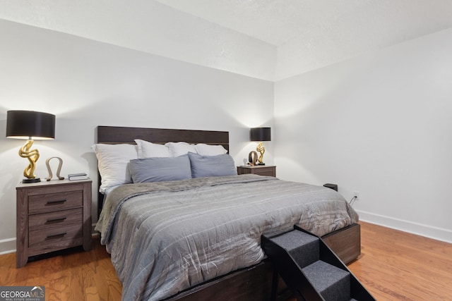 bedroom featuring hardwood / wood-style floors