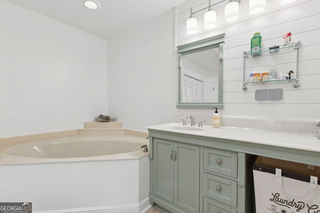 bathroom featuring vanity and a bathing tub