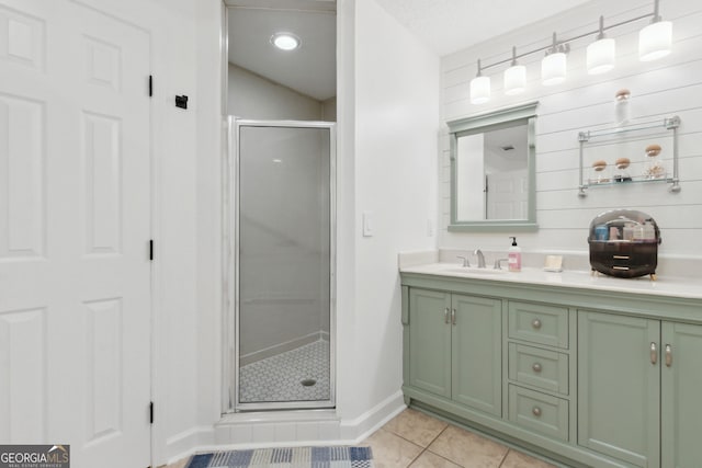 bathroom featuring vanity, tile patterned floors, and an enclosed shower