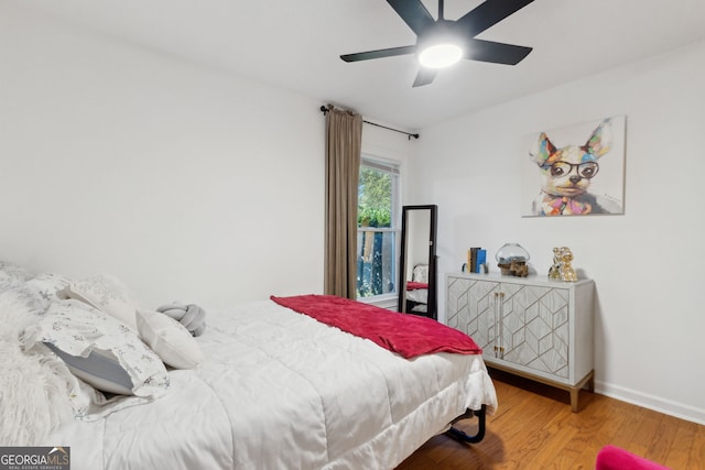 bedroom featuring ceiling fan and hardwood / wood-style floors