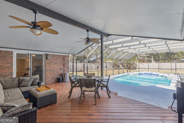 exterior space with a lanai, an outdoor hangout area, and a wooden deck