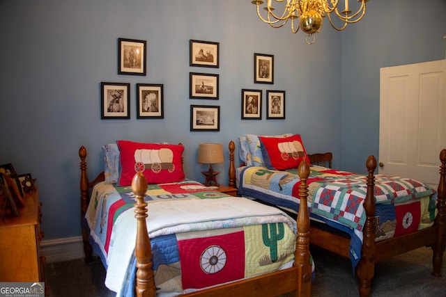 carpeted bedroom featuring a chandelier