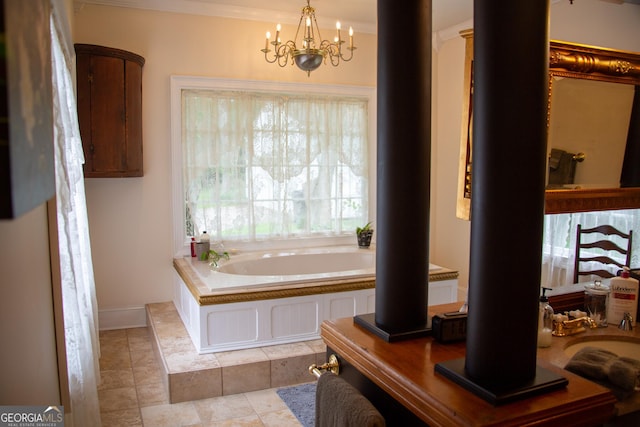 bathroom featuring an inviting chandelier, tile patterned flooring, crown molding, and a bathtub