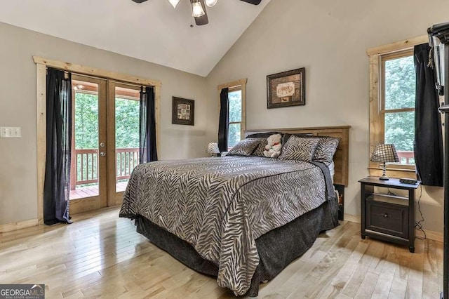 bedroom featuring ceiling fan, lofted ceiling, access to exterior, light hardwood / wood-style floors, and french doors