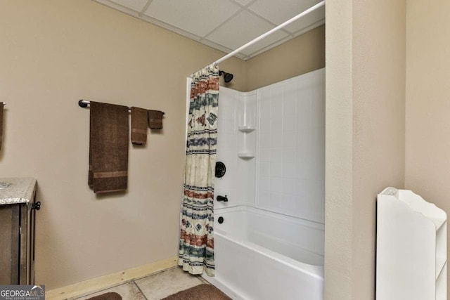 bathroom featuring tile patterned floors, vanity, and shower / bath combination with curtain