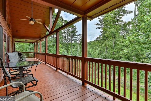 wooden terrace featuring ceiling fan