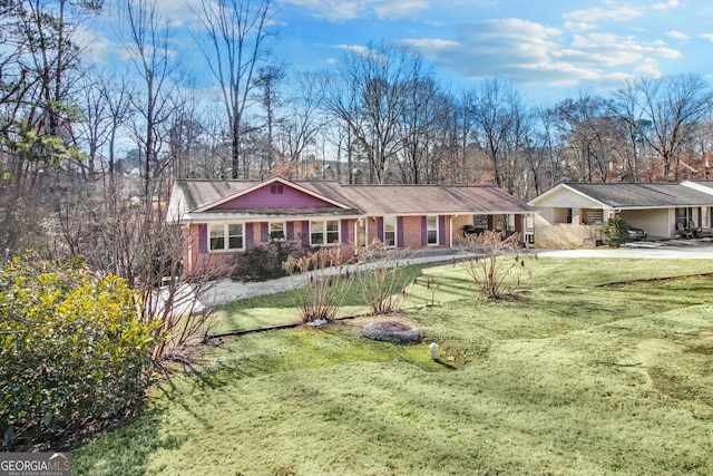 ranch-style home featuring a front yard