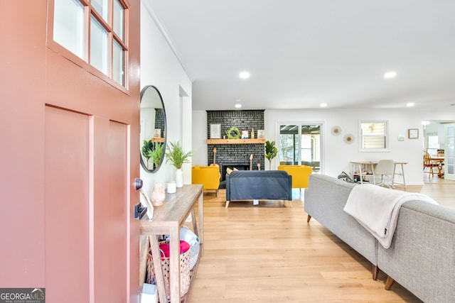 living room featuring a fireplace and light hardwood / wood-style floors