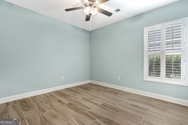 walk in closet with wood finished floors