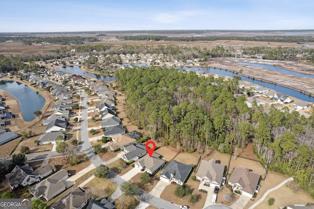 aerial view with a residential view and a water view
