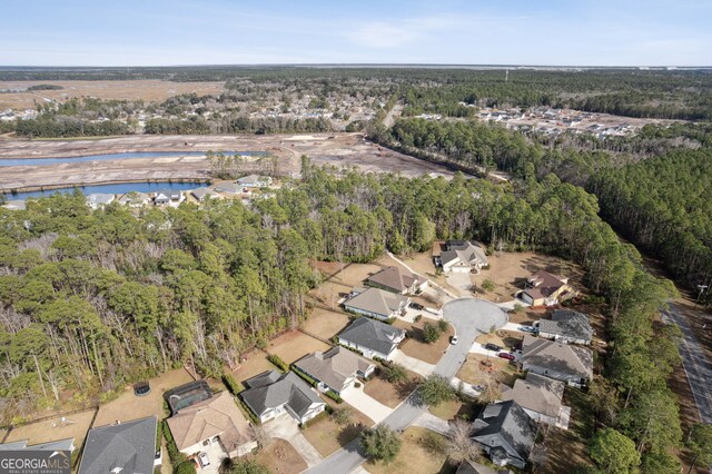 bird's eye view featuring a residential view and a water view