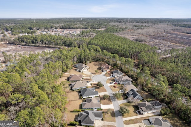 bird's eye view with a forest view, a residential view, and a water view