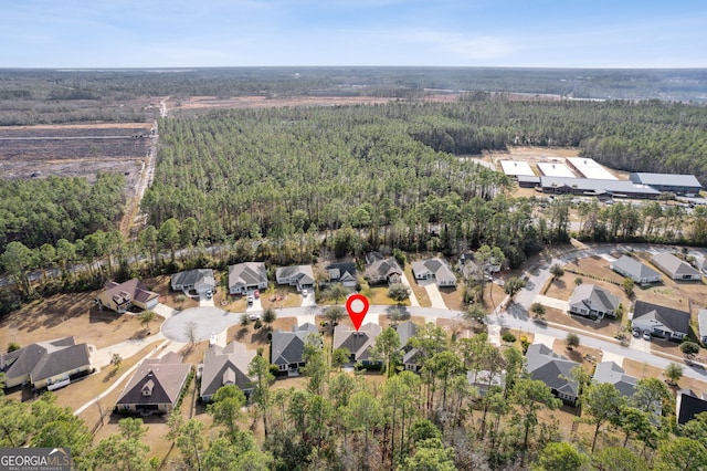 aerial view featuring a residential view and a view of trees