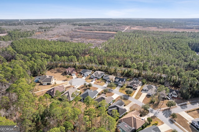 aerial view featuring a residential view and a forest view