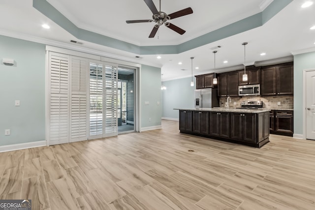 entrance foyer featuring light wood-style flooring, ornamental molding, baseboards, and recessed lighting