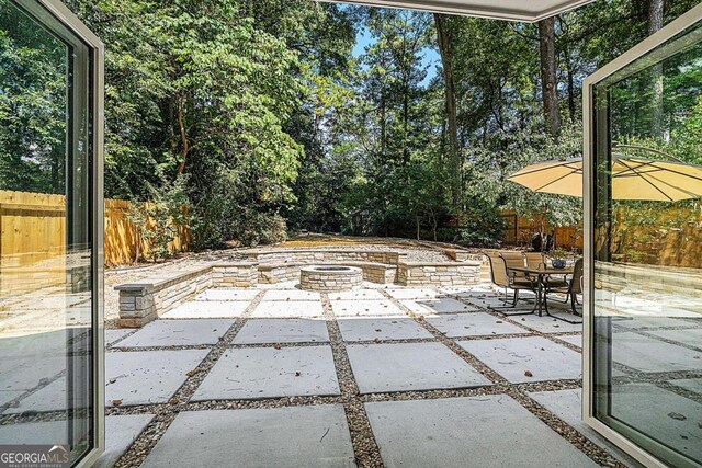 view of patio / terrace featuring a fire pit