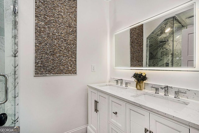 bathroom featuring vanity and a shower with door