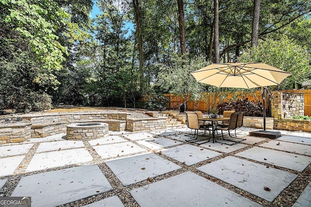 view of patio featuring a fire pit