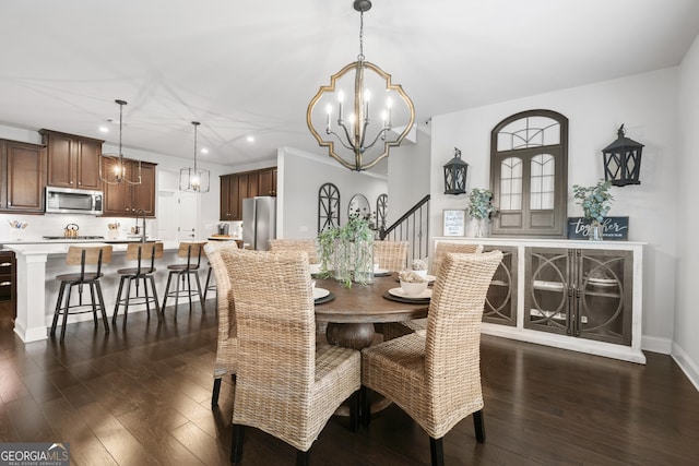 dining area featuring an inviting chandelier and dark hardwood / wood-style floors