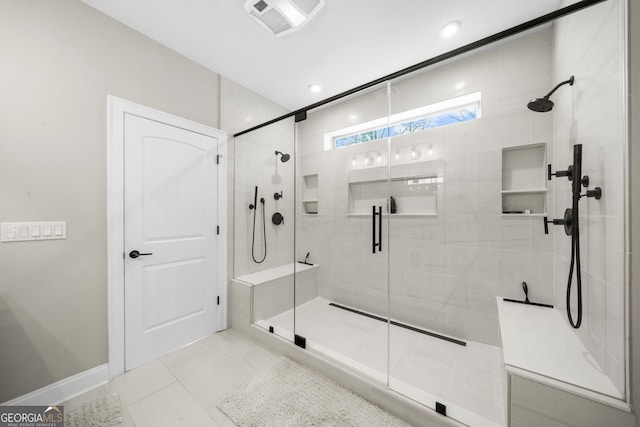 full bath featuring a shower stall, baseboards, and visible vents