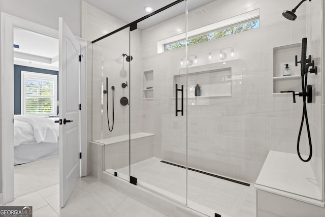 bathroom with a shower with shower door