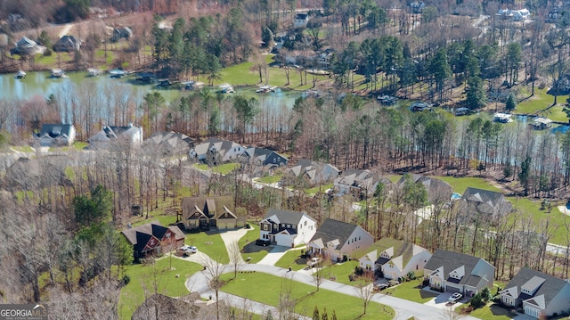 birds eye view of property featuring a residential view and a water view
