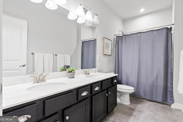 bathroom featuring vanity, a shower with curtain, toilet, and tile patterned floors