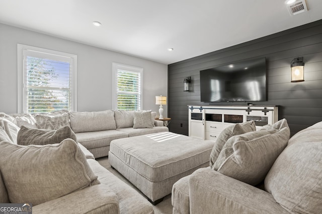 living room featuring wood walls