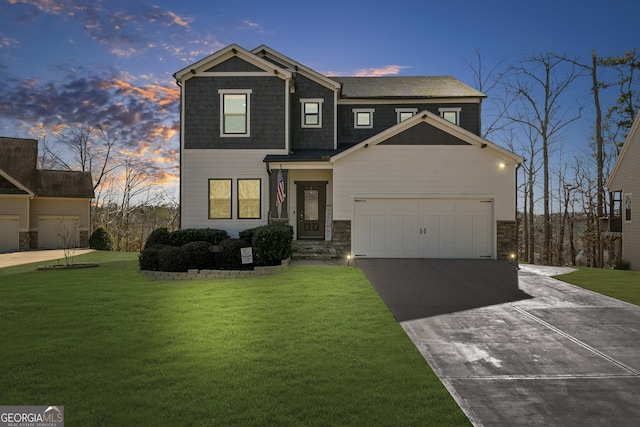 view of front of house featuring a garage, stone siding, concrete driveway, and a front yard