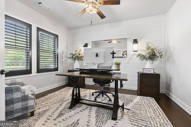 office space with dark wood-type flooring and ceiling fan