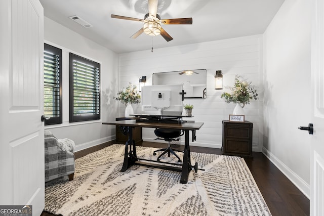 home office with baseboards, wood finished floors, visible vents, and ceiling fan