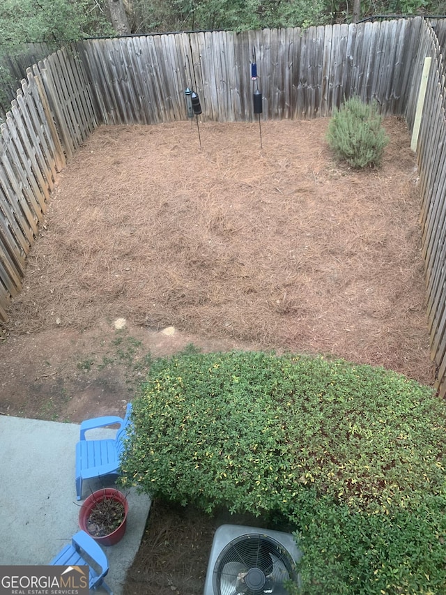 view of yard with central AC unit