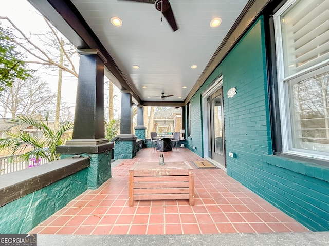 view of patio featuring ceiling fan