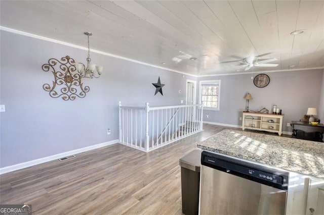 kitchen with ceiling fan with notable chandelier, dishwasher, ornamental molding, light stone counters, and light hardwood / wood-style flooring