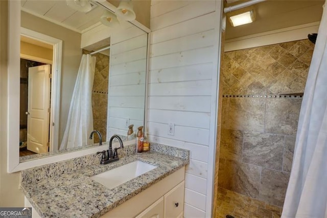 bathroom with vanity, crown molding, and a shower with curtain