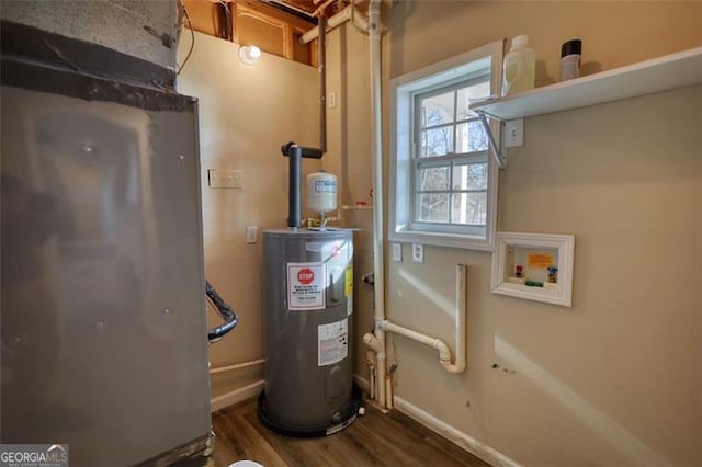 utility room featuring water heater