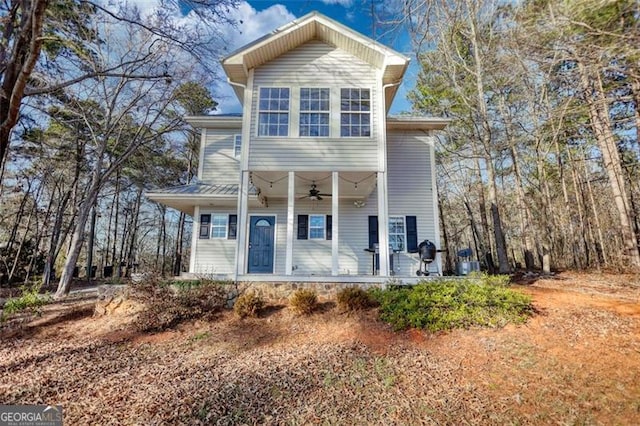 front facade with ceiling fan and a porch