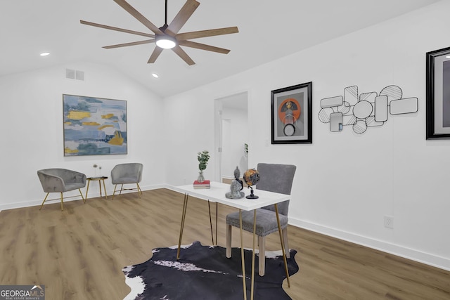 office space featuring ceiling fan, hardwood / wood-style flooring, and vaulted ceiling