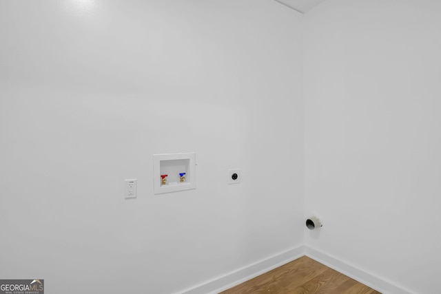 laundry area with wood-type flooring, hookup for a washing machine, and electric dryer hookup