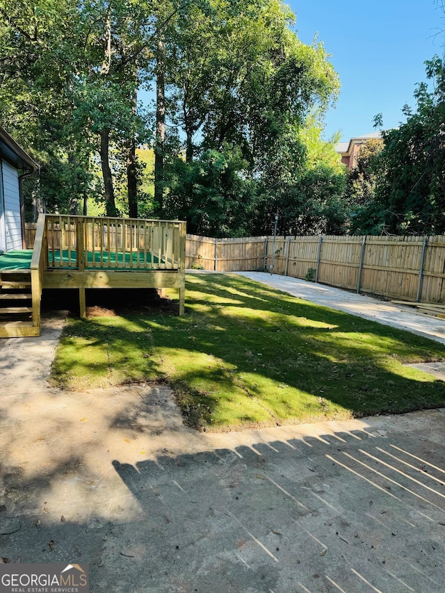 view of yard with a deck