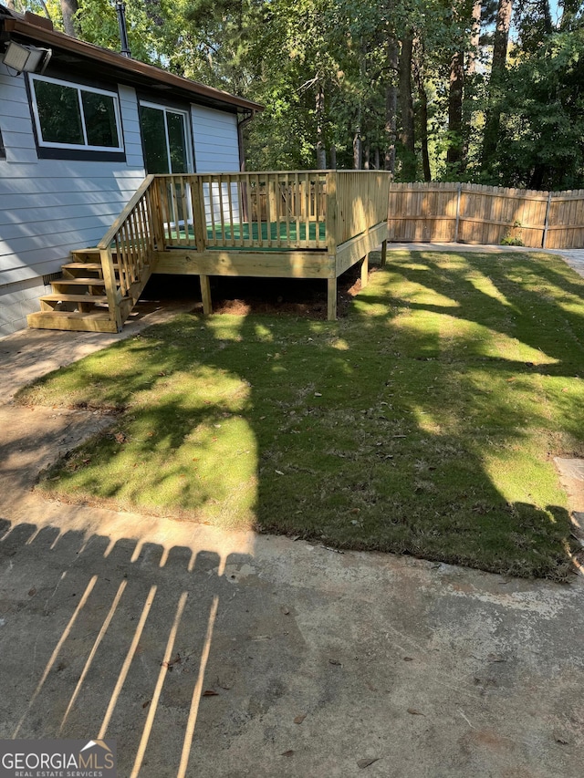 view of yard featuring a wooden deck