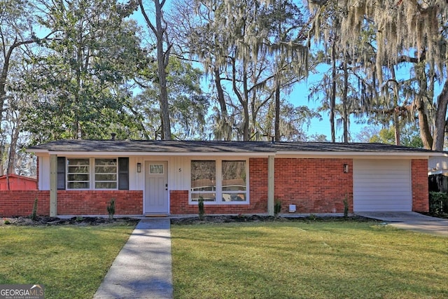 ranch-style home featuring a front yard and brick siding