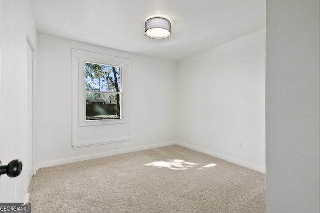 spare room featuring carpet floors