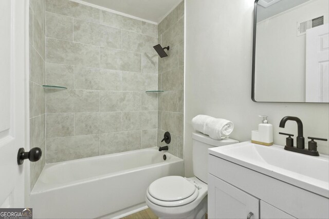 bathroom featuring toilet, a shower with door, and vanity