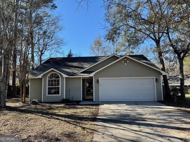 single story home featuring a garage