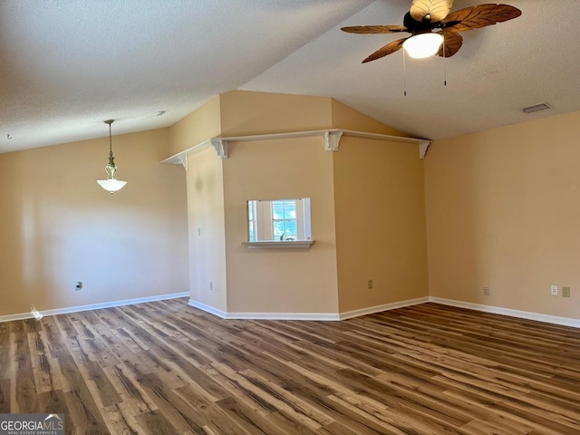 unfurnished living room with vaulted ceiling, wood-type flooring, ceiling fan, and a textured ceiling