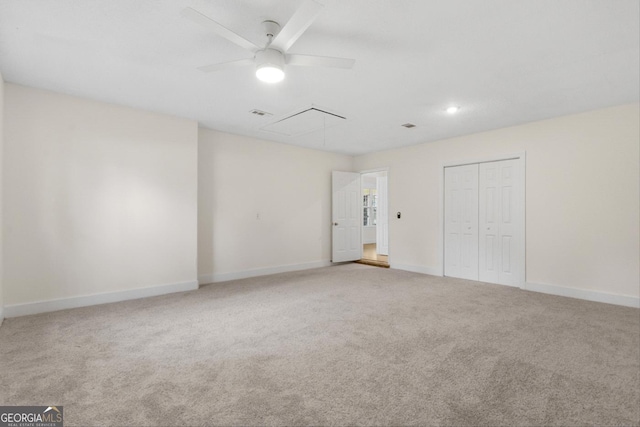 empty room featuring ceiling fan and carpet flooring